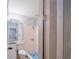 Bathroom featuring vanity, tile floors, and walk in shower with blue tile accents at 1017 Winding Water Way, Clermont, FL 34714