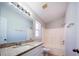 Bright bathroom featuring granite vanity, tub-shower combo and tile floors at 1017 Winding Water Way, Clermont, FL 34714