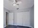 Bedroom featuring new floors, neutral paint, ceiling fan, and closet for storage at 1017 Winding Water Way, Clermont, FL 34714
