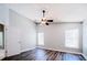 Bright bedroom features modern floors, neutral paint, and a ceiling fan at 1017 Winding Water Way, Clermont, FL 34714