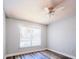 Bedroom with ceiling fan and new flooring; large window provides lots of natural light at 1017 Winding Water Way, Clermont, FL 34714