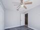 Bedroom with neutral paint, ceiling fan, new floors and a closet for storage at 1017 Winding Water Way, Clermont, FL 34714