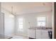 Kitchen with white cabinetry, granite countertops, stainless steel sink and stainless steel appliances at 1017 Winding Water Way, Clermont, FL 34714