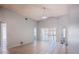 Bright and spacious living room with tiled flooring, fan, vaulted ceiling, and access to the lanai at 1017 Winding Water Way, Clermont, FL 34714