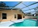 Relaxing screened-in pool area offers the perfect space for outdoor entertainment at 1017 Winding Water Way, Clermont, FL 34714