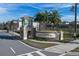 The community entryway features attractive signage, landscaping, and architectural details, creating a welcoming and sophisticated entrance at 1034 Splash Shot Pl, Davenport, FL 33896