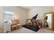 Spacious workout room equipped with a treadmill, desk, and mirror at 1335 Palmetto Dunes St, Davenport, FL 33836