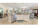 Open kitchen with granite countertops, stainless dishwasher, and white cabinets at 1335 Palmetto Dunes St, Davenport, FL 33836
