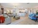 Open-concept living area connecting kitchen, dining, and seating areas at 1335 Palmetto Dunes St, Davenport, FL 33836
