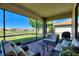 Relaxing screened patio with comfortable seating and golf course views at 1335 Palmetto Dunes St, Davenport, FL 33836