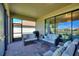 Comfortable screened patio with stylish furniture and a view of the lush surroundings at 1335 Palmetto Dunes St, Davenport, FL 33836