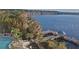 Aerial view of the lake, pool and dock area at 13427 Blue Heron Beach Dr # 1607, Orlando, FL 32821
