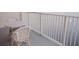 Inviting balcony featuring a table and chairs with stunning views of the shimmering water at 13427 Blue Heron Beach Dr # 1607, Orlando, FL 32821