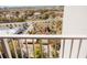 Elevated balcony view overlooking a colorful miniature golf course and surrounding greenery at 13427 Blue Heron Beach Dr # 1607, Orlando, FL 32821