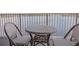 Balcony with woven table and chairs and great water views at 13427 Blue Heron Beach Dr # 1607, Orlando, FL 32821