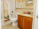 Bathroom featuring a granite countertop vanity, toilet, and bathtub with a shower at 13427 Blue Heron Beach Dr # 1607, Orlando, FL 32821