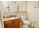 Bathroom featuring a sink with granite countertops, toilet and towel rack at 13427 Blue Heron Beach Dr # 1607, Orlando, FL 32821
