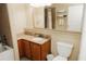 Well-lit bathroom with a large mirror, vanity, sink, and a shower-tub combination at 13427 Blue Heron Beach Dr # 1607, Orlando, FL 32821