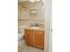 Bathroom featuring a vanity with a granite counter top and plenty of room to store bathroom accessories at 13427 Blue Heron Beach Dr # 1607, Orlando, FL 32821