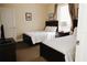 Bedroom featuring two twin beds, bedside table, and a view of a doorway to an adjacent room at 13427 Blue Heron Beach Dr # 1607, Orlando, FL 32821