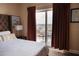 Bedroom with balcony, patio seating, and a view at 13427 Blue Heron Beach Dr # 1607, Orlando, FL 32821