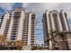 Beautiful shot of the two condo buildings with a clear, blue sky at 13427 Blue Heron Beach Dr # 1607, Orlando, FL 32821