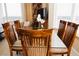 The dining room features a glass table with seating for six and views of the surrounding area at 13427 Blue Heron Beach Dr # 1607, Orlando, FL 32821