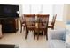 Dining room featuring a glass table, seating for four, and entertainment center at 13427 Blue Heron Beach Dr # 1607, Orlando, FL 32821