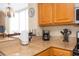 Bright kitchen featuring granite countertops, stainless appliances and a chandelier above the dining table at 13427 Blue Heron Beach Dr # 1607, Orlando, FL 32821