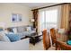Living room with modern furniture, balcony access, and a view of the ocean at 13427 Blue Heron Beach Dr # 1607, Orlando, FL 32821