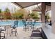 Inviting community pool area with ample seating and shade, perfect for relaxation and socializing at 13427 Blue Heron Beach Dr # 1607, Orlando, FL 32821