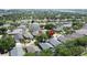 Neighborhood aerial showcasing lush landscaping and well-maintained homes near a golf course and lake at 1361 Rebecca Dr, Haines City, FL 33844