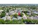Community aerial view showcasing the home's location in a neighborhood with mature trees at 1361 Rebecca Dr, Haines City, FL 33844