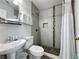 Updated bathroom featuring a tiled shower and modern sink and vanity at 1361 Rebecca Dr, Haines City, FL 33844