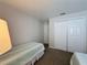 Bedroom featuring two beds, neutral walls, carpeting and closet storage at 1361 Rebecca Dr, Haines City, FL 33844
