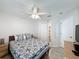Spacious bedroom featuring a queen bed, hardwood style floors, and access to the bathroom at 1361 Rebecca Dr, Haines City, FL 33844