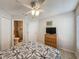This is a spacious bedroom with a ceiling fan, and en suite bath at 1361 Rebecca Dr, Haines City, FL 33844