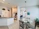 Charming breakfast nook open to the kitchen, featuring a glass table and bright lighting at 1361 Rebecca Dr, Haines City, FL 33844