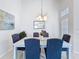 Elegant dining room with a modern chandelier and seating for six at 1361 Rebecca Dr, Haines City, FL 33844