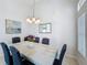 Well-lit dining room with a decorative chandelier and ample space for Gathering gatherings at 1361 Rebecca Dr, Haines City, FL 33844