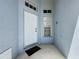 Close-up of the front entrance with a white door and decorative window at 1361 Rebecca Dr, Haines City, FL 33844
