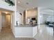 Open kitchen featuring granite countertops, white appliances, and an open layout at 1361 Rebecca Dr, Haines City, FL 33844