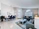 Open concept living room with dining area, neutral tones and plenty of natural light at 1361 Rebecca Dr, Haines City, FL 33844