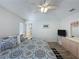 Bright bedroom featuring neutral walls, wood-look floors and a ceiling fan at 1361 Rebecca Dr, Haines City, FL 33844