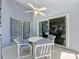 Covered patio includes seating and overlooks the screened in pool at 1361 Rebecca Dr, Haines City, FL 33844