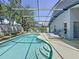 Sparkling screened-in pool with lounge chairs and steps for easy access at 1361 Rebecca Dr, Haines City, FL 33844