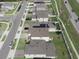Aerial view showing suburban homes with lush lawns and orderly street layout at 1371 Red Blossom Ln, Kissimmee, FL 34746