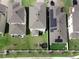 An aerial view shows backyard with trampoline and solar panels on roof at 1371 Red Blossom Ln, Kissimmee, FL 34746