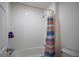 Clean, tiled bathroom with a shower and tub combination at 1371 Red Blossom Ln, Kissimmee, FL 34746