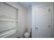 A modern bathroom features a toilet and ample natural light at 1371 Red Blossom Ln, Kissimmee, FL 34746